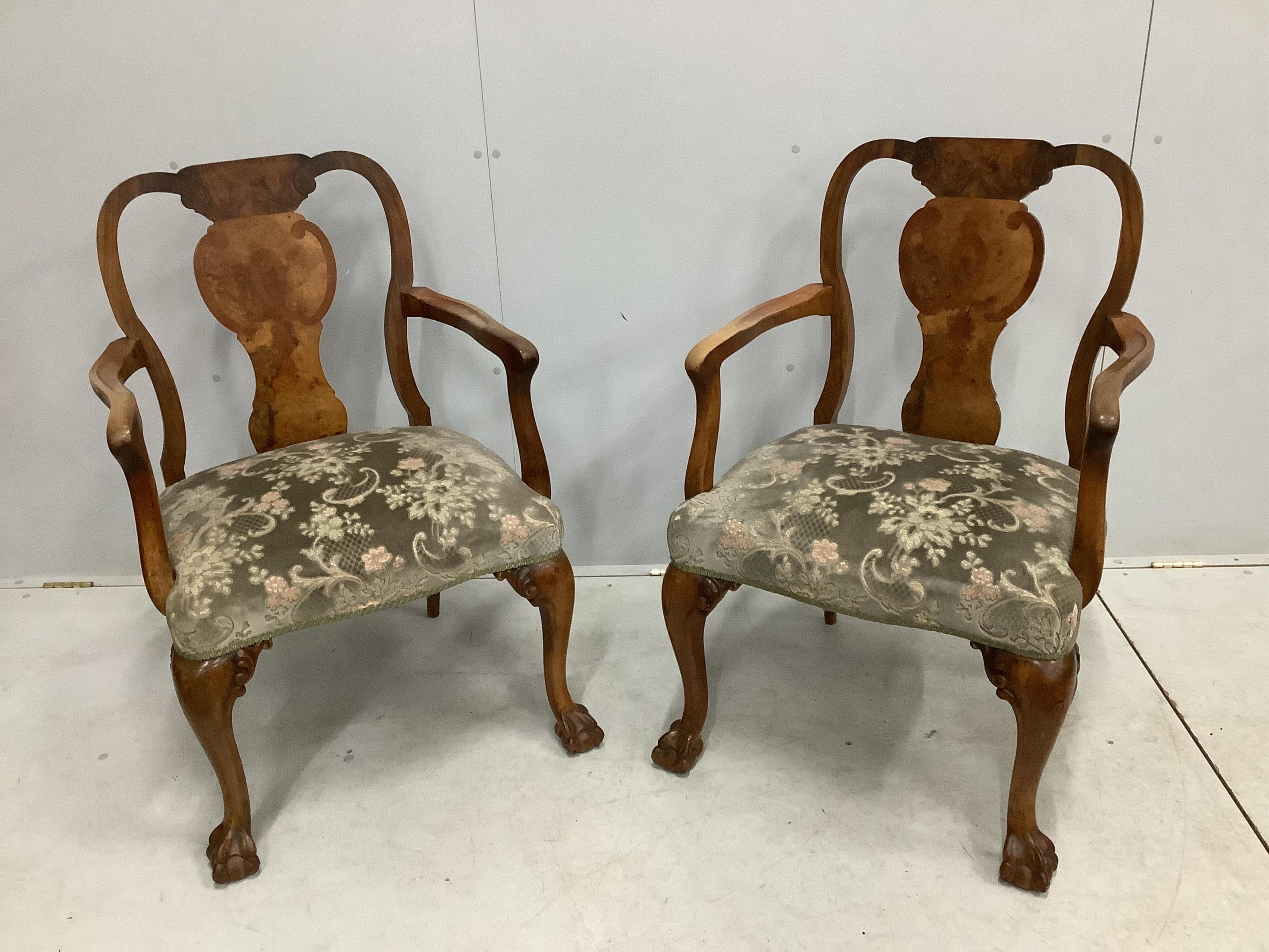 A pair of Queen Anne Revival banded walnut elbow chairs, width 62cm, depth 53cm, height 95cm. Condition - fair (one arm slightly loose)